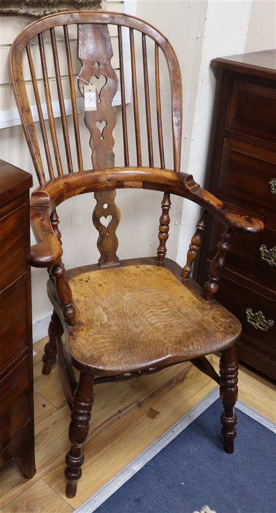 A harlequin set of six Victorian heart motif yew and elm Windsor chairs